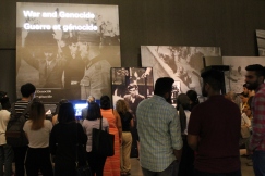 Students look on at the Examining the Holocaust exhibit