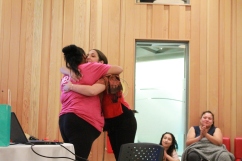 Youth Program Coordinator, Crystal Leach, hugs student at Mawi Wi Chi Itata Centre